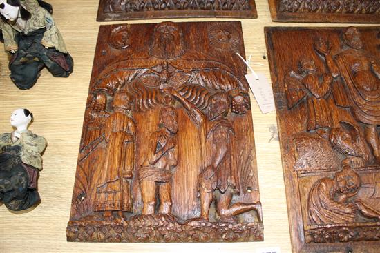 A set of four 19th century Continental relief carved oak religious plaques, depicting biblical scenes, 38 x 29cm